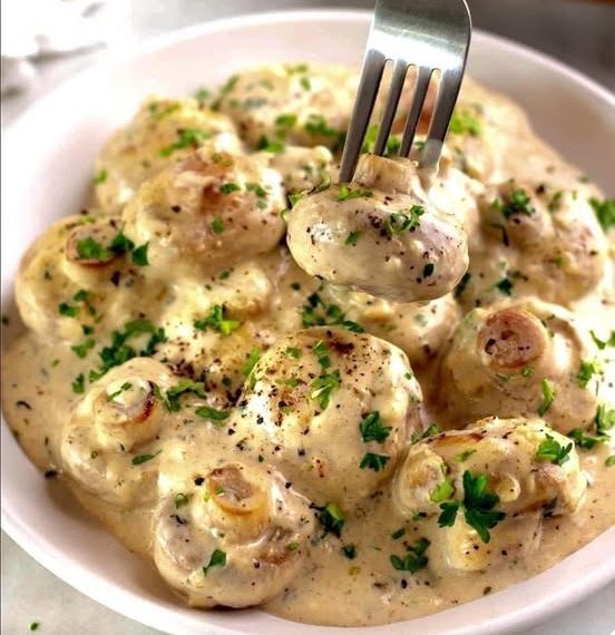 Knoblauchpilze in Parmesankäse